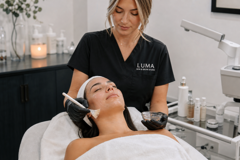 Client receiving a relaxing customized facial in a modern skincare studio