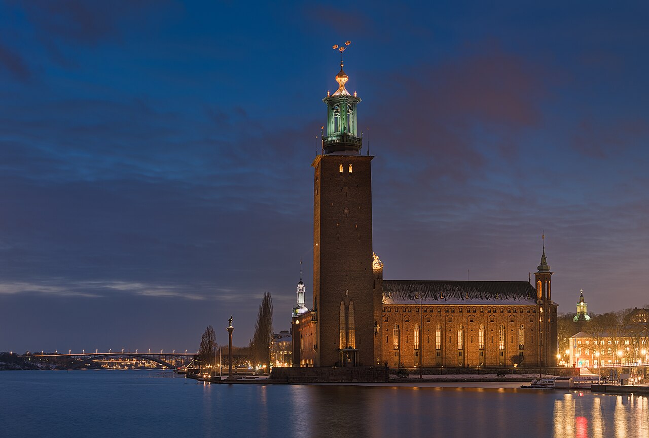 Stockholm City Hall tower and Lake Mälaren's light reflections at night