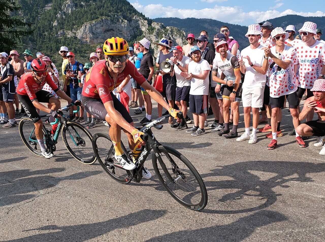Barriers and crowd along the Tour de France route (2024, Stage 20, Col de la Couillole) — the real density of roadside spectators