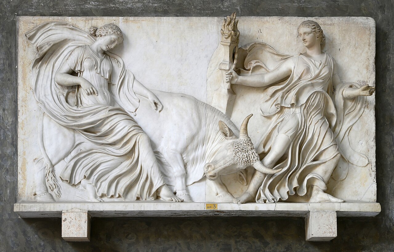 Ancient Roman marble relief in the Vatican Museums depicting two maenads and a bull