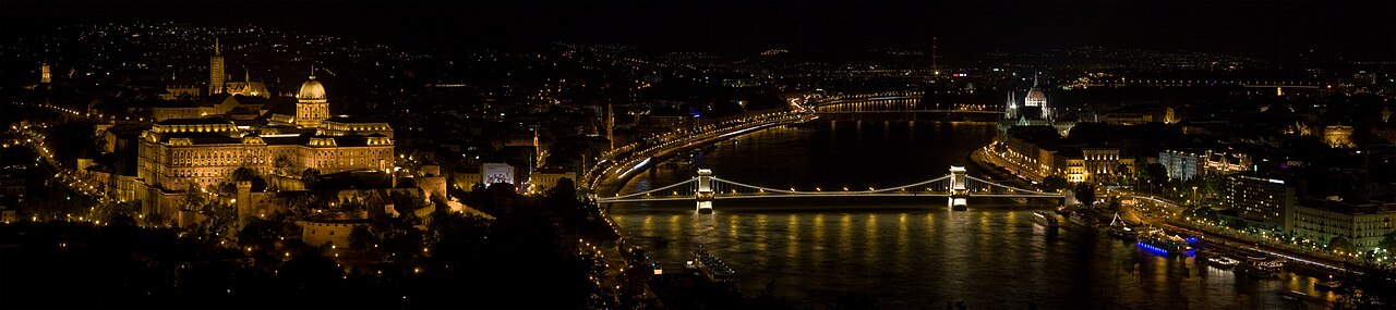 View of Budapest and the Danube from Gellért Hill—Sziget's home, Óbudai Island, lies upstream on the Danube