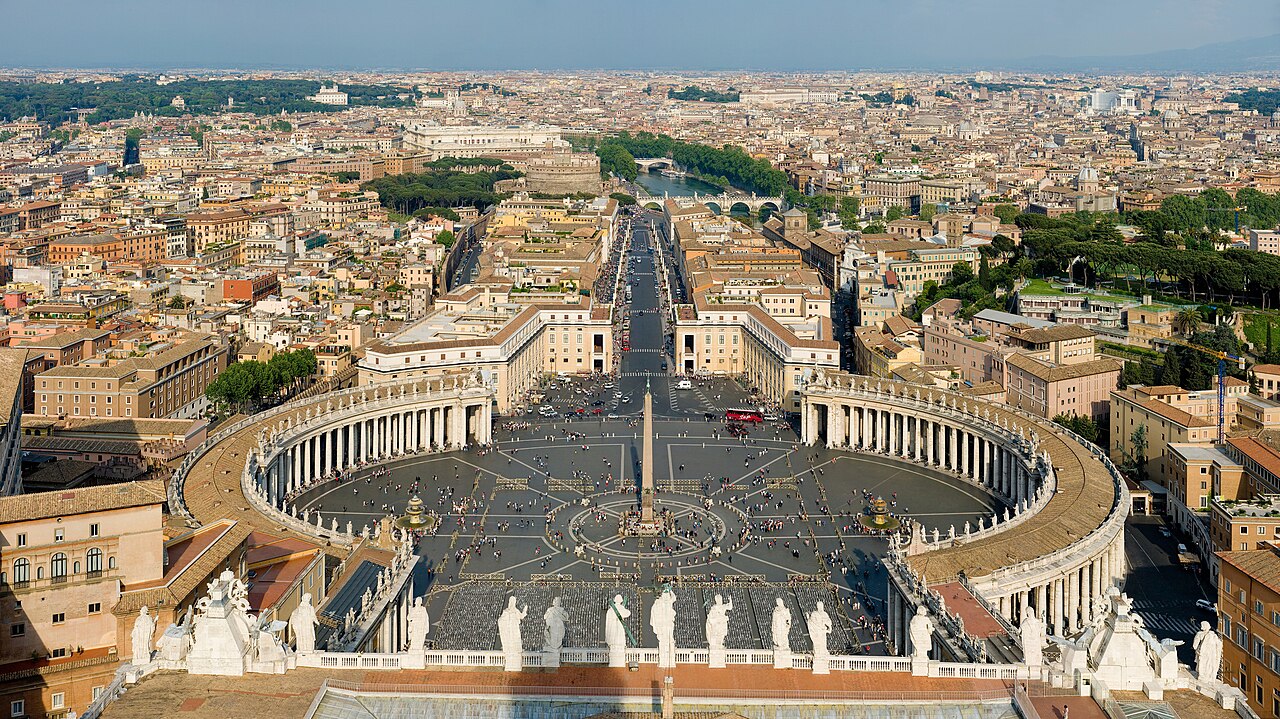 Panoramic view from the dome of St. Peter's Basilica overlooking St. Peter's Square, the obelisk, and downtown Rome