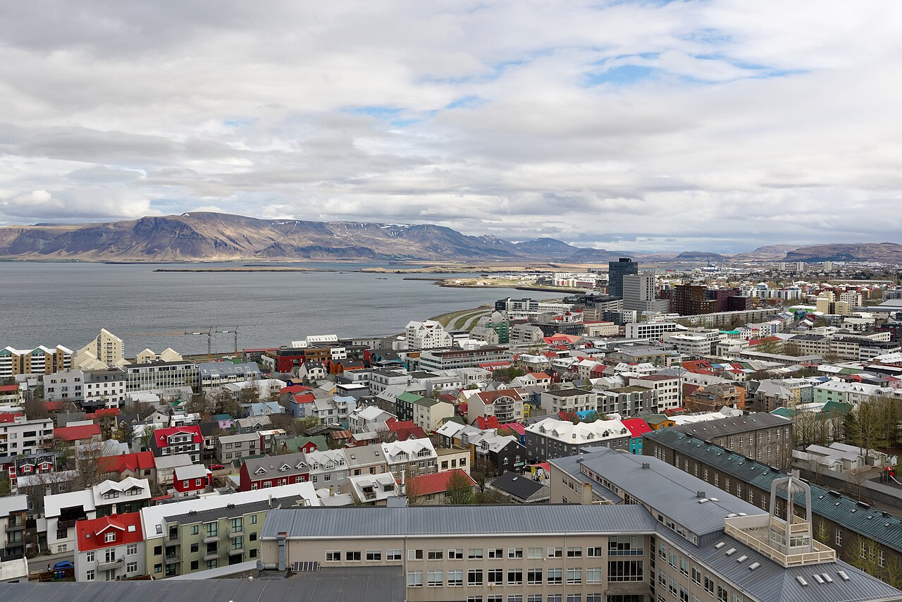 View of Reykjavik city center from Hallgrímskirkja — book accommodation for the registration week within walking distance of this area