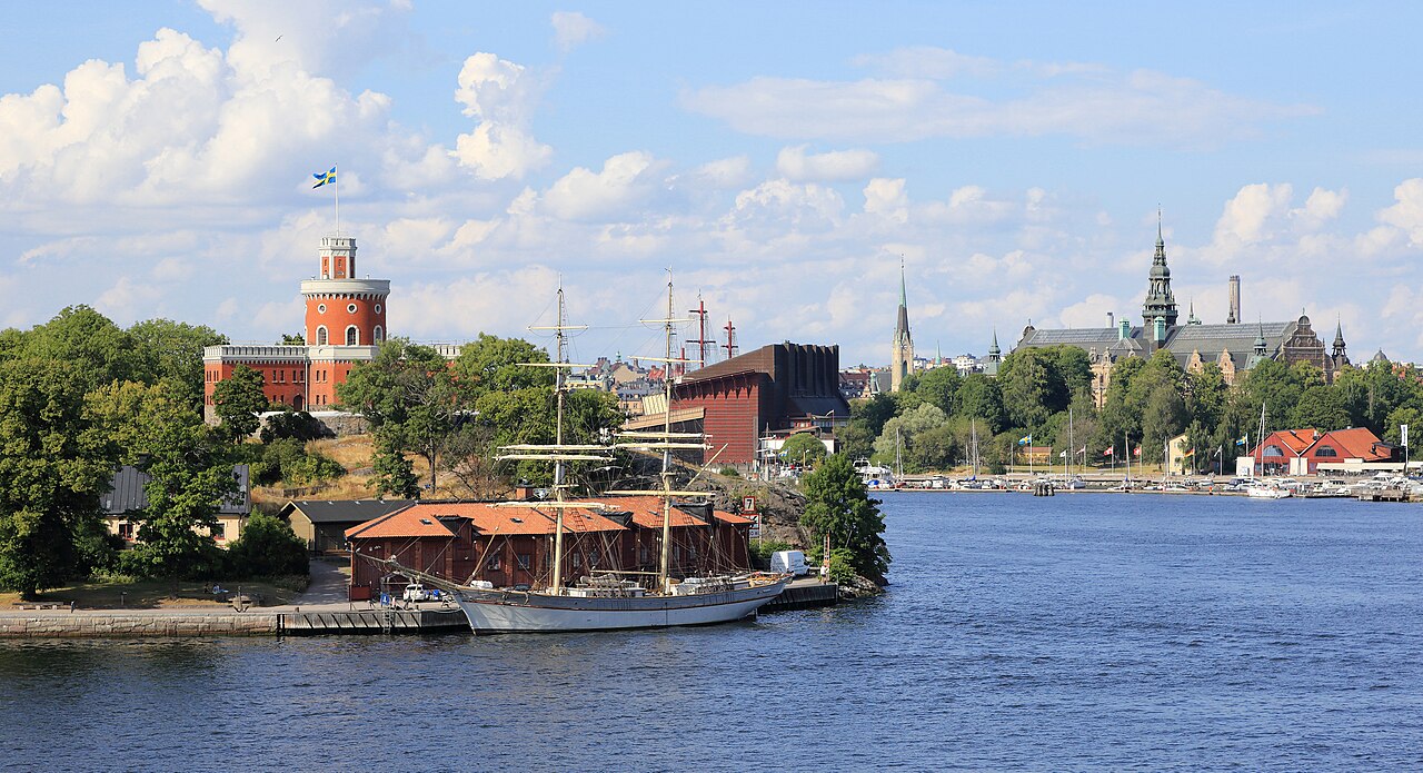 Stockholm waterways and Djurgården, red Kastellet Tower, sailboats, and the Nordic Museum spire