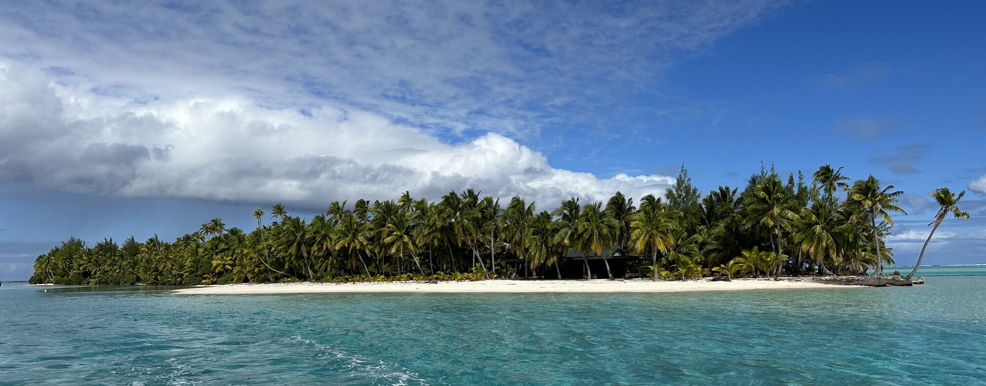 Tapuaetai One Foot Island with shallow lagoon water