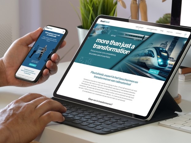 iPhone en Macbook met de website van Fleetshield in beeld