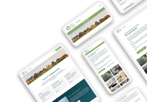 Laptop en telefoon met daarop de website van Het Meethuys