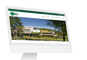 Laptop en telefoon met daarop de website van Hovenier De Vuursche