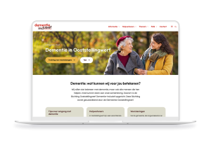 Laptop en telefoon met daarop de website van Dementie Ooststellingwerf