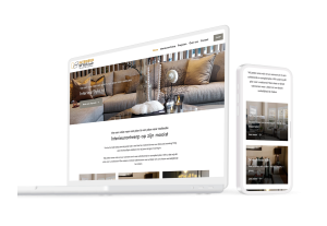 Laptop en telefoon met daarop de website van InterieurStyle
