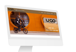 Laptop en telefoon met daarop de website van U.GO Mobility