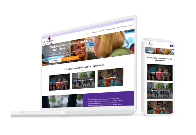 Laptop en telefoon met daarop de website van Basisschool De Windwijzer