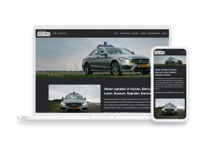 Laptop en telefoon met daarop de website van Autorijschool Helmig