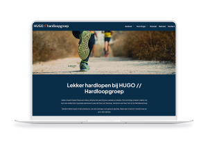 Laptop en telefoon met daarop de website van HUGO // Hardloopgroep