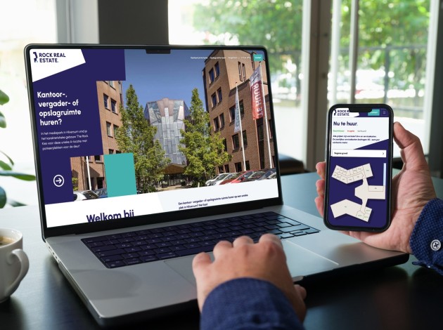 Laptop en telefoon met daarop de website van Rock Real Estate