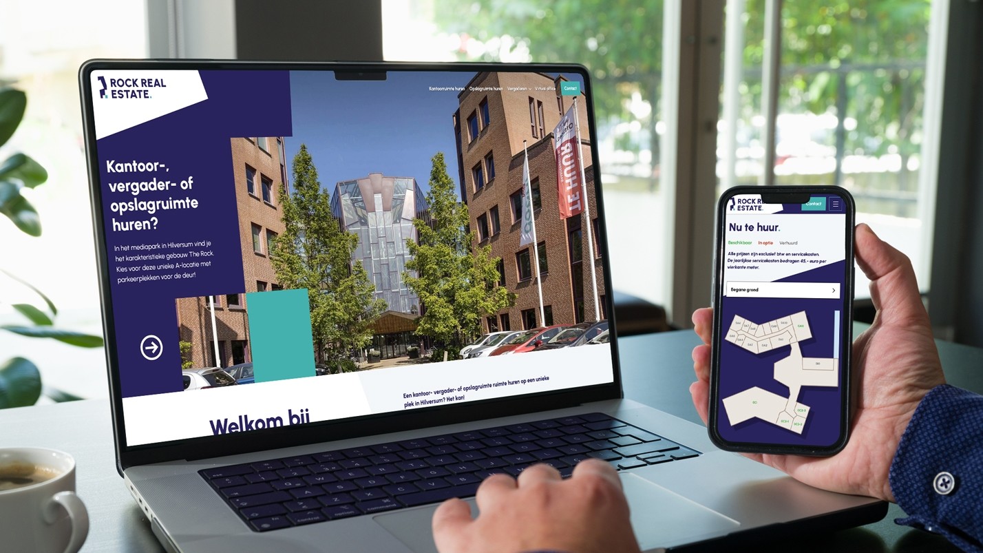 Laptop en telefoon met daarop de website van Rock Real Estate