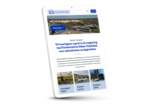 Laptop en telefoon met daarop de website van Rijnders Touringcars