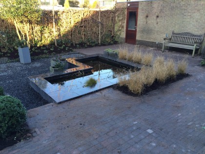 Creëer beleving in de tuin met een vijver