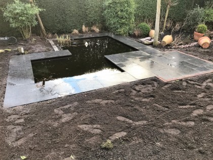 Creëer beleving in de tuin met een vijver