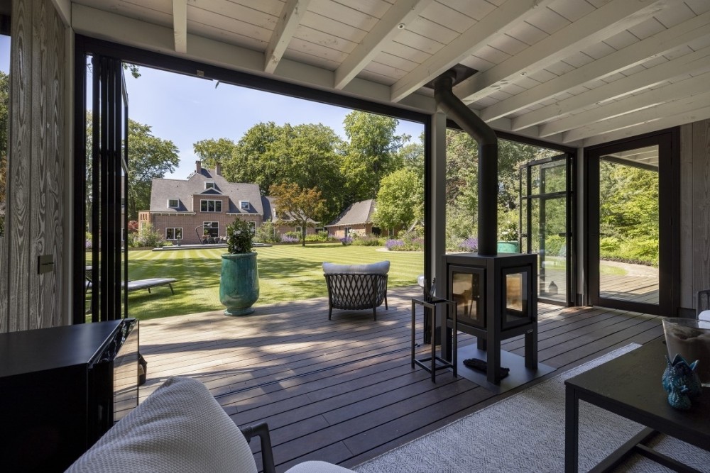 Tuinaanleg met luxe buitenverblijf | Huizen