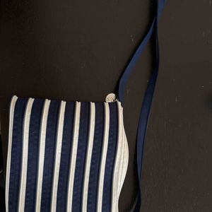 Sac bandoulière à multiples compartiments zippés 