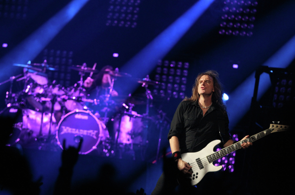 Former Megadeth members performing on stage in Russia