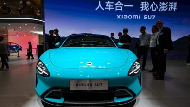 An electric vehicle by Xiaomi on a scenic road in Germany, symbolizing innovation and technology.