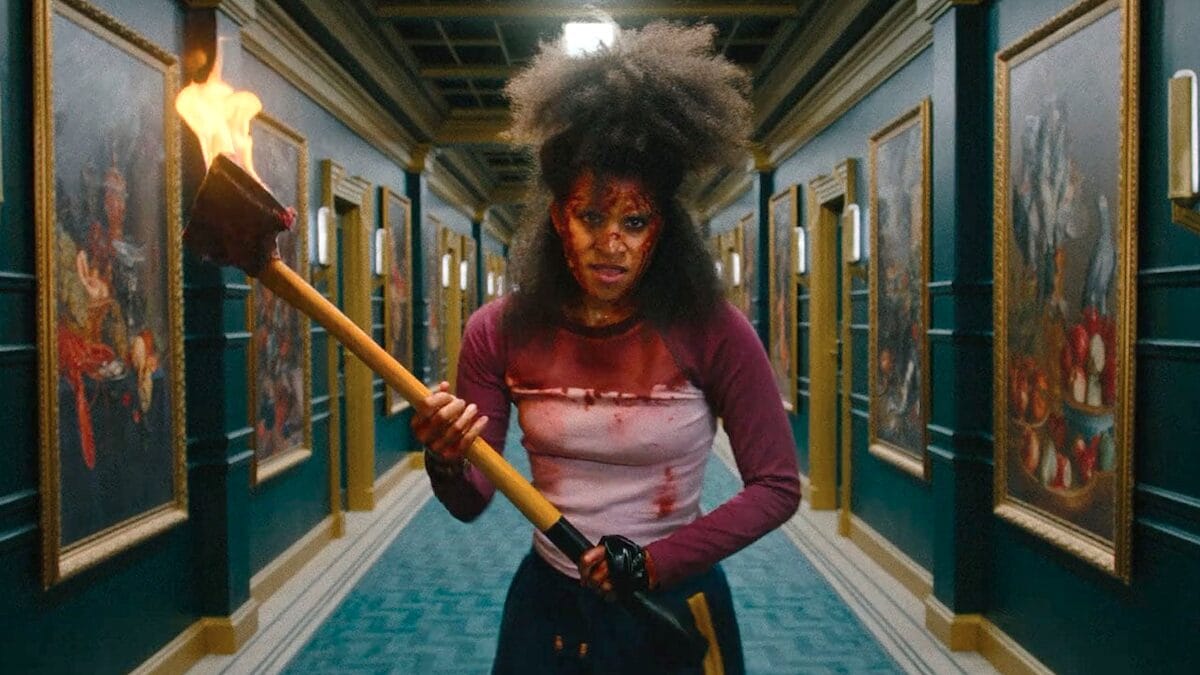 Zazie beetz holding flaming axe they will kill you 01 1200x675