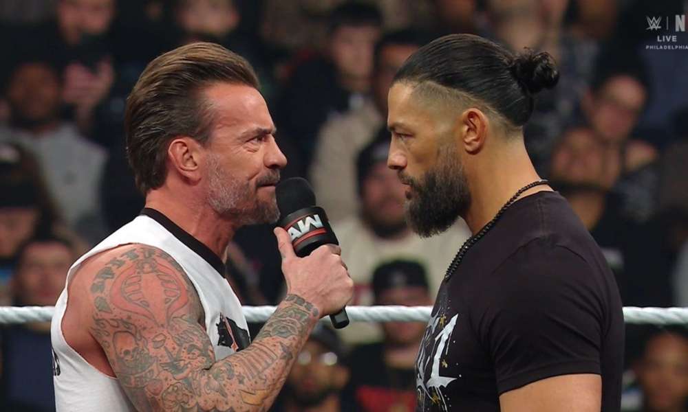 Cm punk vs roman reigns 1000x600