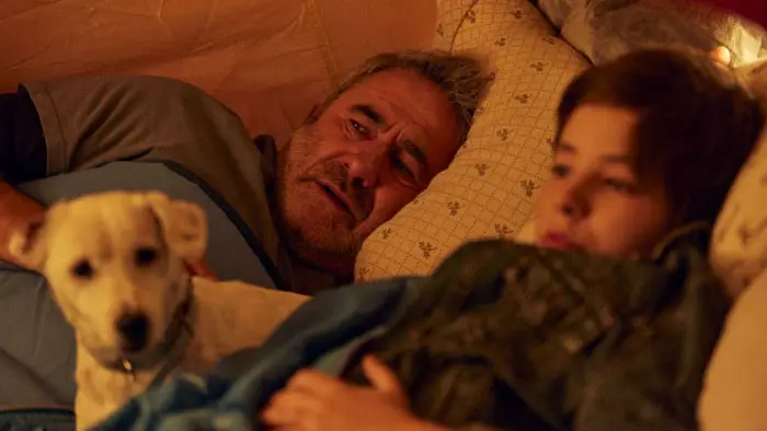 Sirat 2026 film still father son dog tent bed