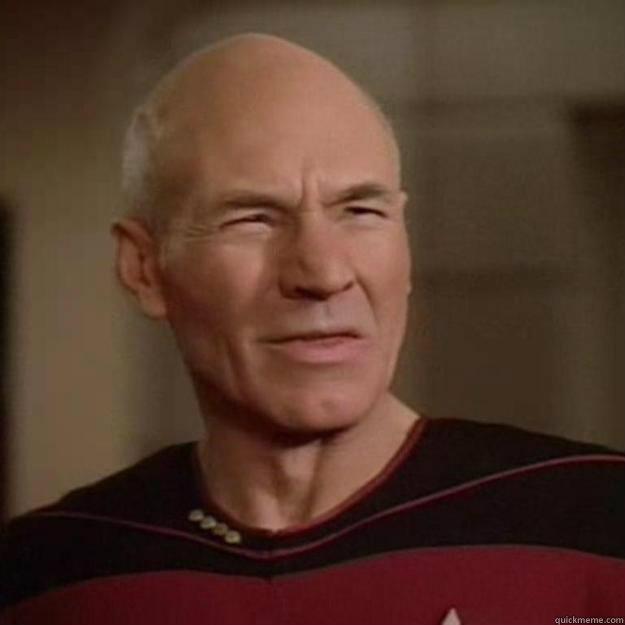 captain jean luc picard of the uss enterprise. looking disgusted.