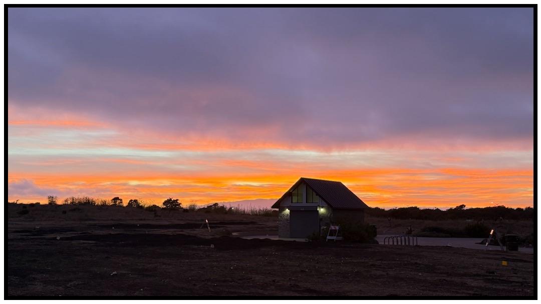 Vibrant sunset sky featuring shades of orange, pink, and purple.