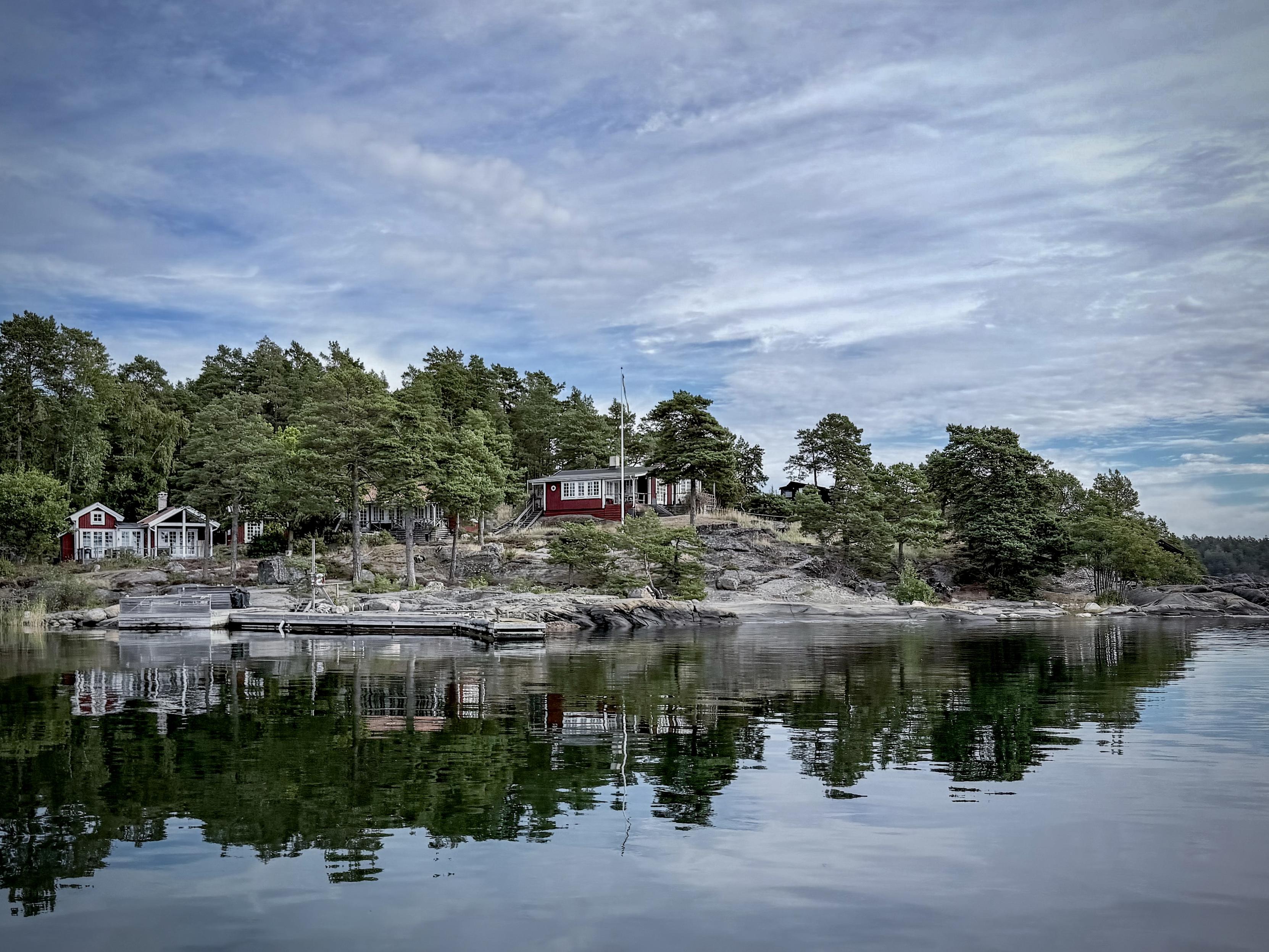 An island surrounded by calm waters.